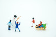 © Montri Thipsorn - Snowman miniature toy and children people figure playing around. Seasonal, Kid and family concept.