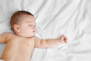 Wall Mural - Cute little baby sleeping on bed at home