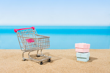 Wall Mural - Summer signings, shopping travel. Cart on the beach