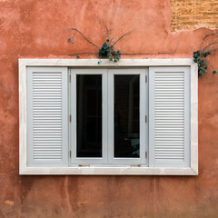 European style window with brick wall background