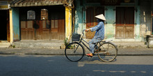 Riding Bicycle In The Street Of Hoi An In Vietnam