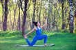 © Aliaksandr Barouski - Young woman doing yoga exercises in the summer city park. Health lifestyle concept.