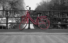 Black And White View Of Amsterdam With Redbicycle