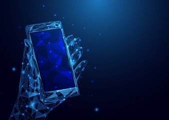 Wall Mural - abstract low polygon a hand holding smartphone wireframe mesh on blue background