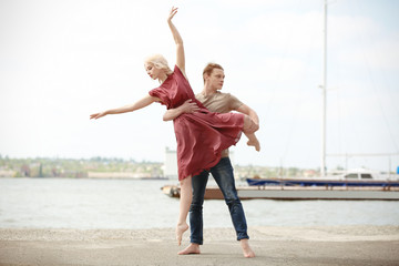 Wall Mural - Passionate couple dancing outdoors