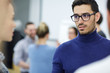 © pressmaster - Young employee listening to one of colleagues during talk