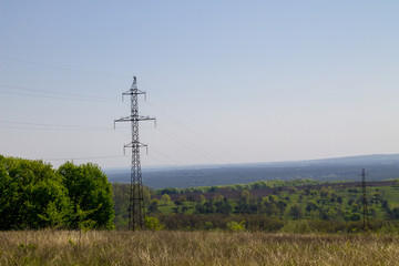 High voltage power line against blue sky