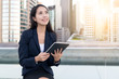 © leungchopan - Businesswoman using tablet computer in Hong Kong