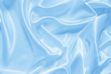 smooth elegant blue silk or satin can use as background