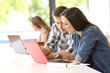 © Antonioguillem - Two students working together in a classroom
