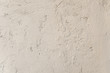 Grunge beige vintage wall with cracks 