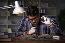 Archeologist Working Late Night In Office
