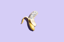 Banana Covered In Diamonds On A Purple Background