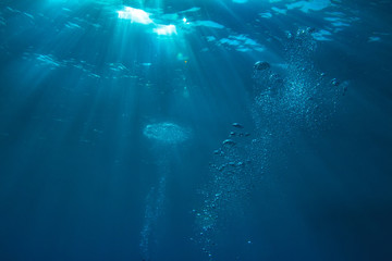 Wall Mural - abstract water background with rays of sun and air bubbles
