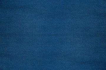 Blue denim background of rough cloth