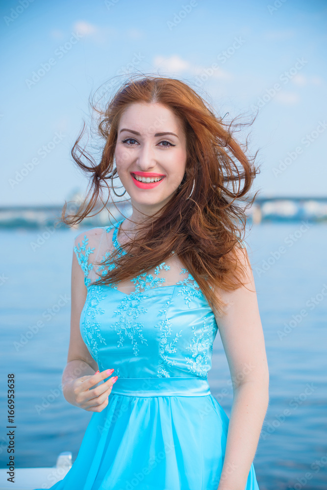 Beautiful girl in light blue bright clothes, pure accessories and makeup,  relax mood, at warm day