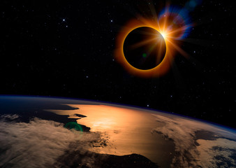 Wall Mural - solar eclipse with orange halo over the planet earth, on dark starry sky