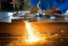 Man Cutting Metal With A Welding Cutting Torch