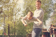 © liderina - Father and son playing on the meadow.