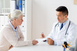 © Syda Productions - woman and doctor with prescription at clinic