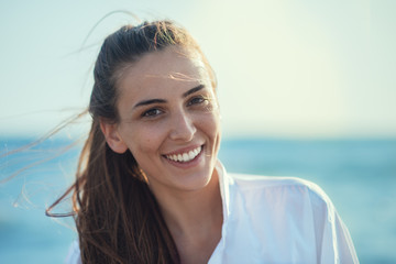 Young smiling girl at the beach