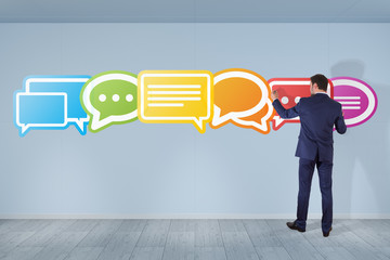 Wall Mural - Businessman using social network interface on a wall 3D rendering