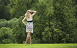 © Andrey_Arkusha - Young beautiful girl stands with her back and looks into the distance