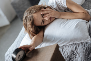 Wall Mural - Sad sleepy woman trying to wake up