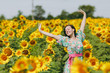 © ViDi Studio - Brunette girl in a field of sunflowers