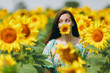 © ViDi Studio - Brunette girl in a field of sunflowers