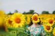 © ViDi Studio - Brunette girl in a field of sunflowers