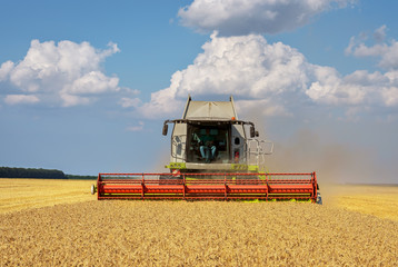 Aufkleber - Close view of modern combine harvester in action.
