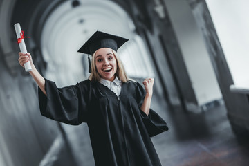 Wall Mural - Female graduate in university