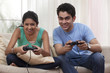 © IndiaPix - Brother and sister playing video game