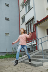 Wall Mural - beautiful young girl posing on the street