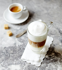 Wall Mural - Glass of Latte Macchiato and a Cup of Espresso