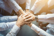 © REDPIXEL - Stack of hands. Unity and teamwork concept.