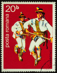 Wall Mural - Romanian folk dancers on postage stamp