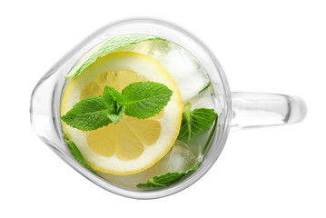 Wall Mural - Glass jug of cold lemonade on white background