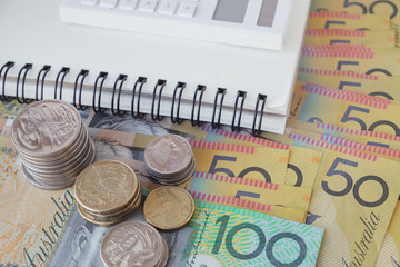 Wall Mural - Australian money, AUD with calculator, notebook, donate, charity, household income, Coronavirus economic stimulus rescue package, superannuation concept