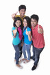© IndiaPix - High angle portrait of college students gesturing thumbs up against white background