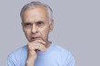 © IndiaPix - Close-up of thoughtful man over gray background