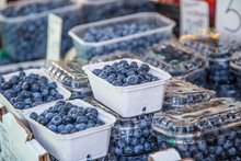 Blueberries On A Farm Market In The City. Fruits And Vegetables At A Farmers Market