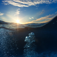 Wall Mural - sky and sea water divided by waterline. ocean aquatic nature design. tropical shining waters