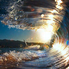 Fototapete - sunset sea curly breaking wave shining in sunlight