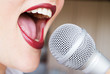 © Angelina - Open female mouth with microphone
