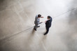 © ReeldealHD images - Overhead shot of two businessmen in a meeting