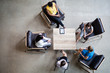 © ReeldealHD images - Overhead shot of group of businesswomen in a meeting