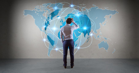 Wall Mural - Businessman using digital planet earth interface on a wall 3D rendering