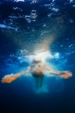 Fototapeta Łazienka - professional female sport master smiling underwater